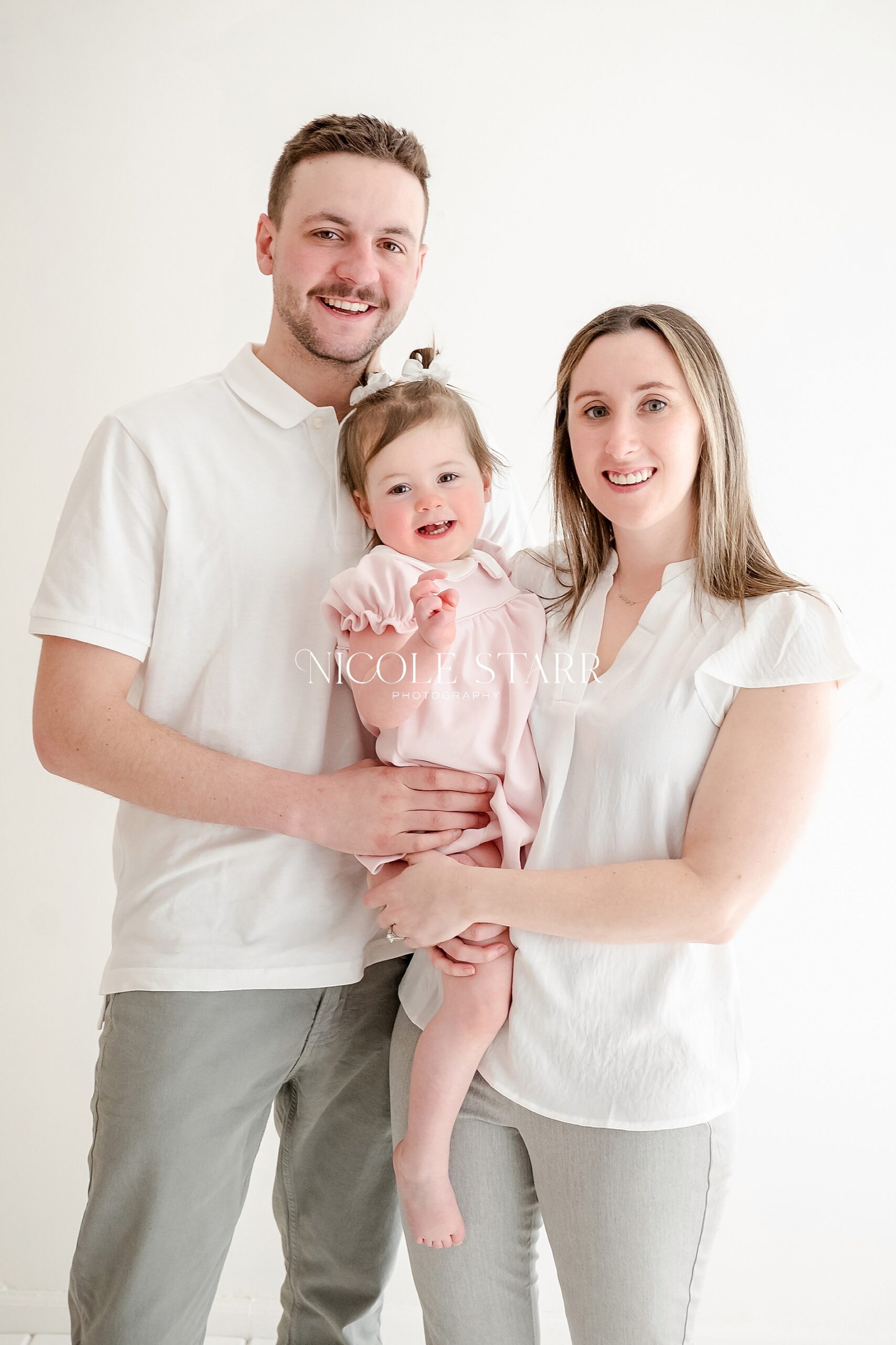 family portraits from A Classic Pink Bow Cake Smash to Celebrate Turning Two
