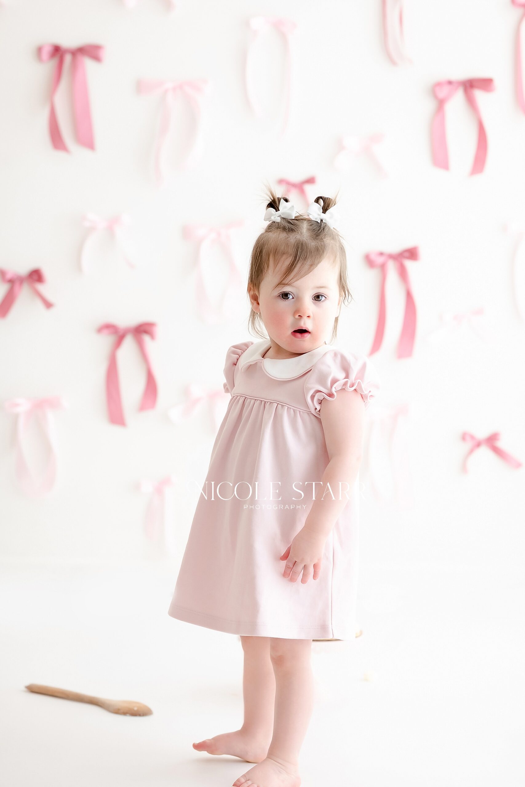 A Classic Pink Bow Cake Smash to Celebrate Turning Two