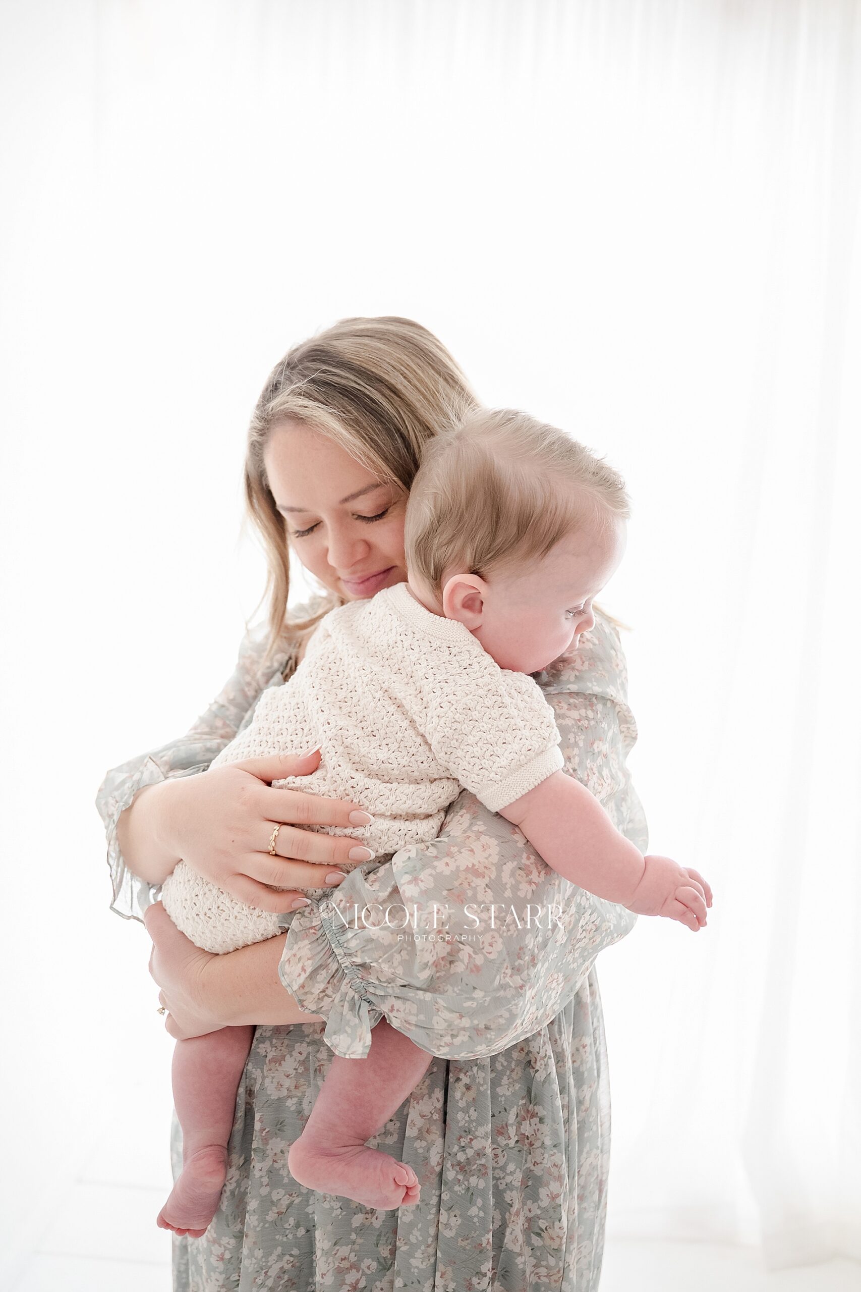 mom holds baby boy