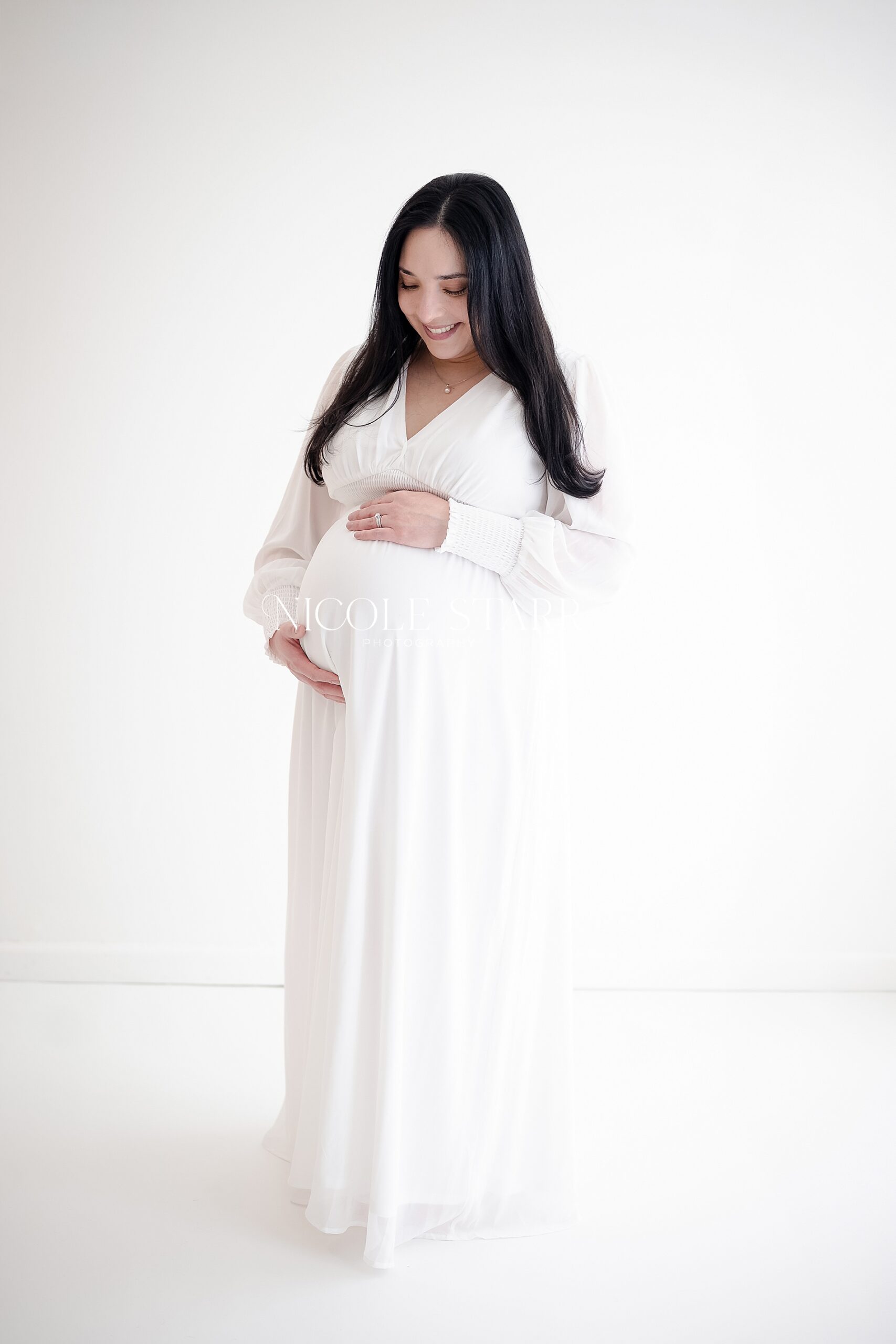 expectant mom in white dress