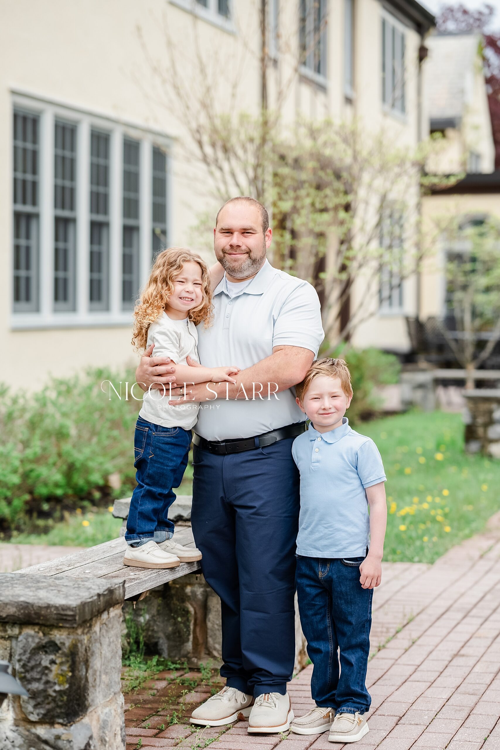 dad with two sons during family portraits in Saratoga Springs