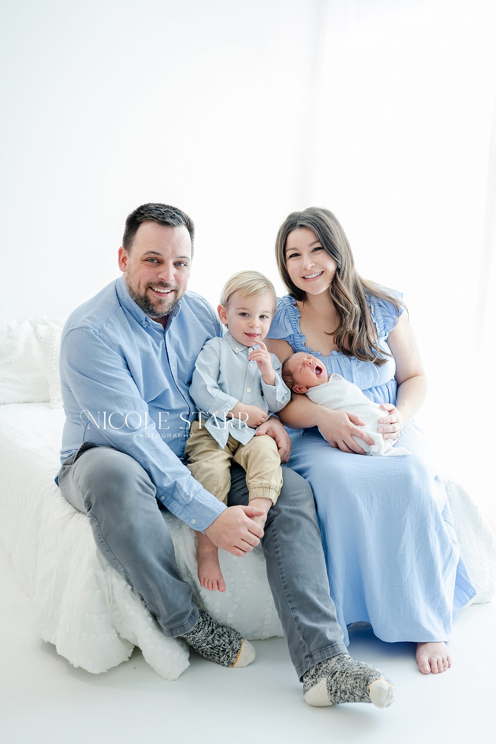 parents with newborn and toddler son
