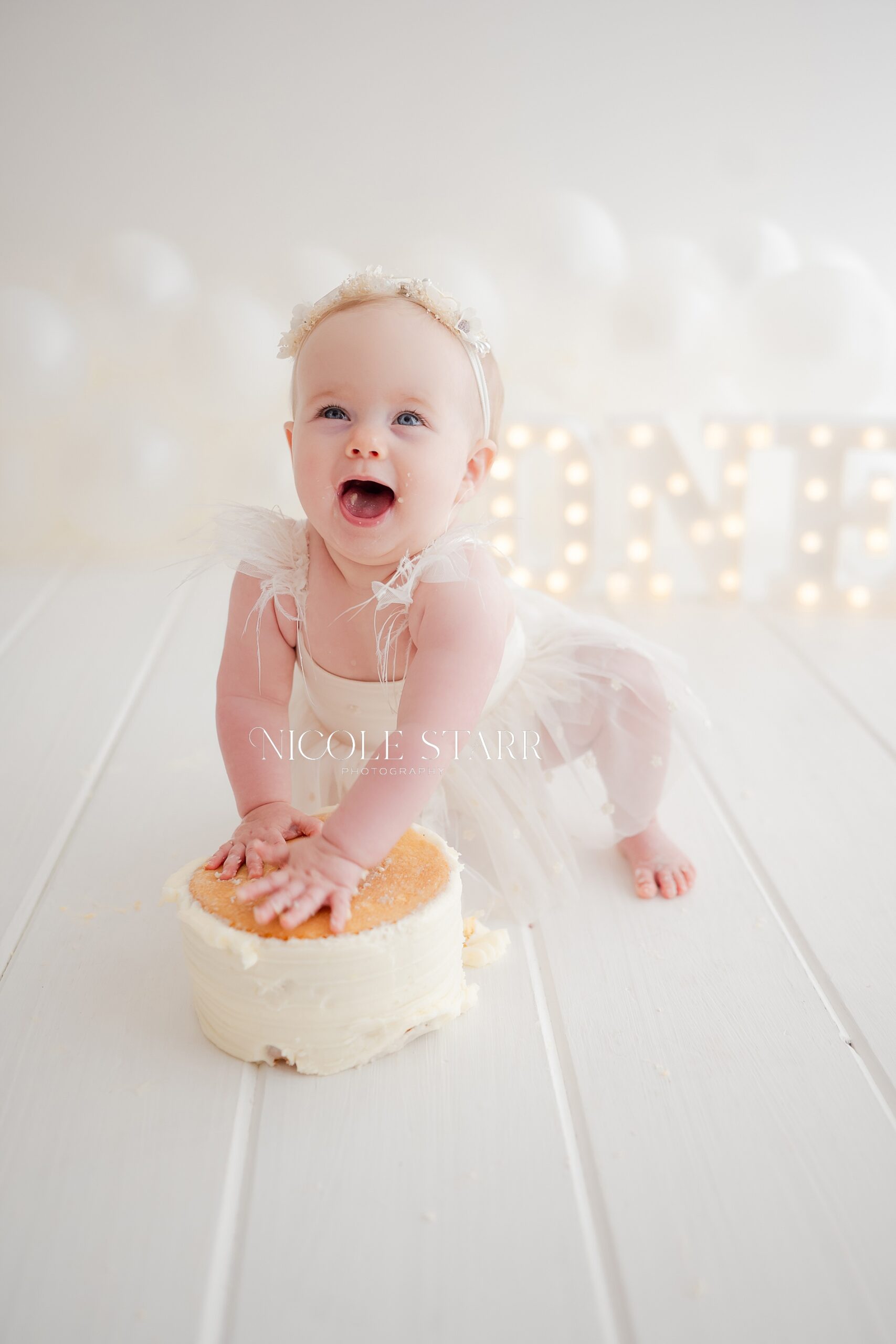joyful baby during cake smash