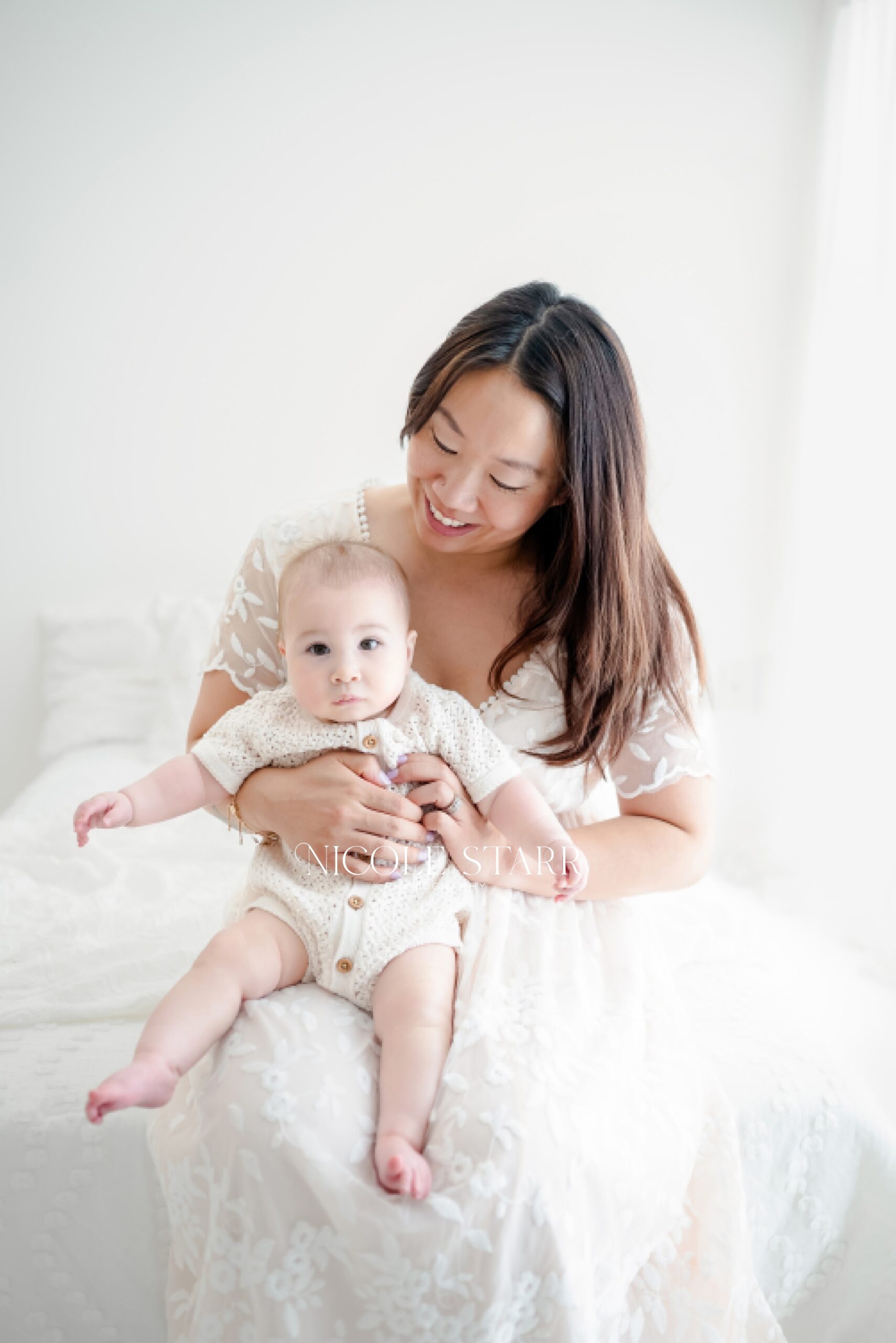 mom holds baby