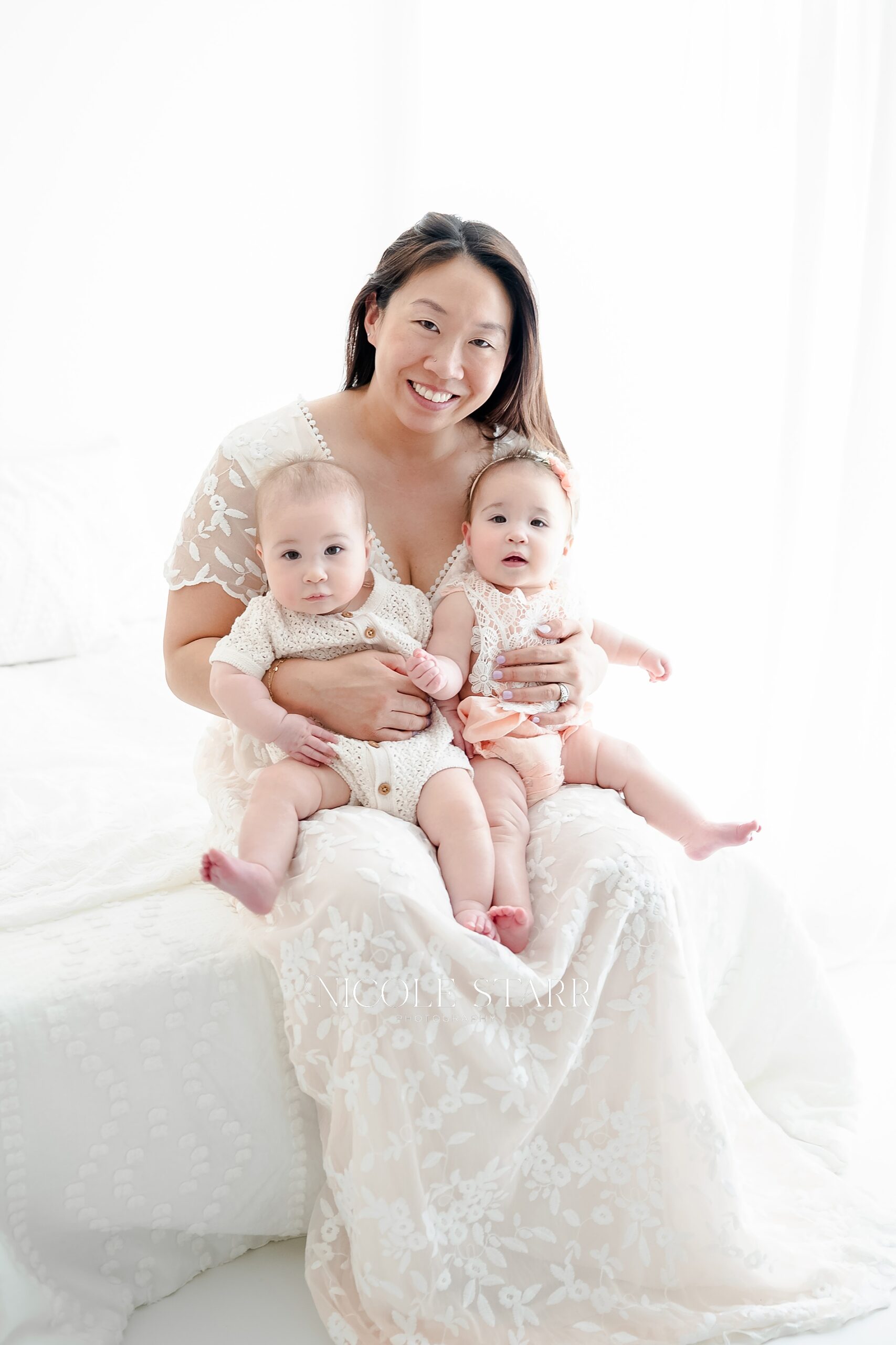 mom holds twin babies
