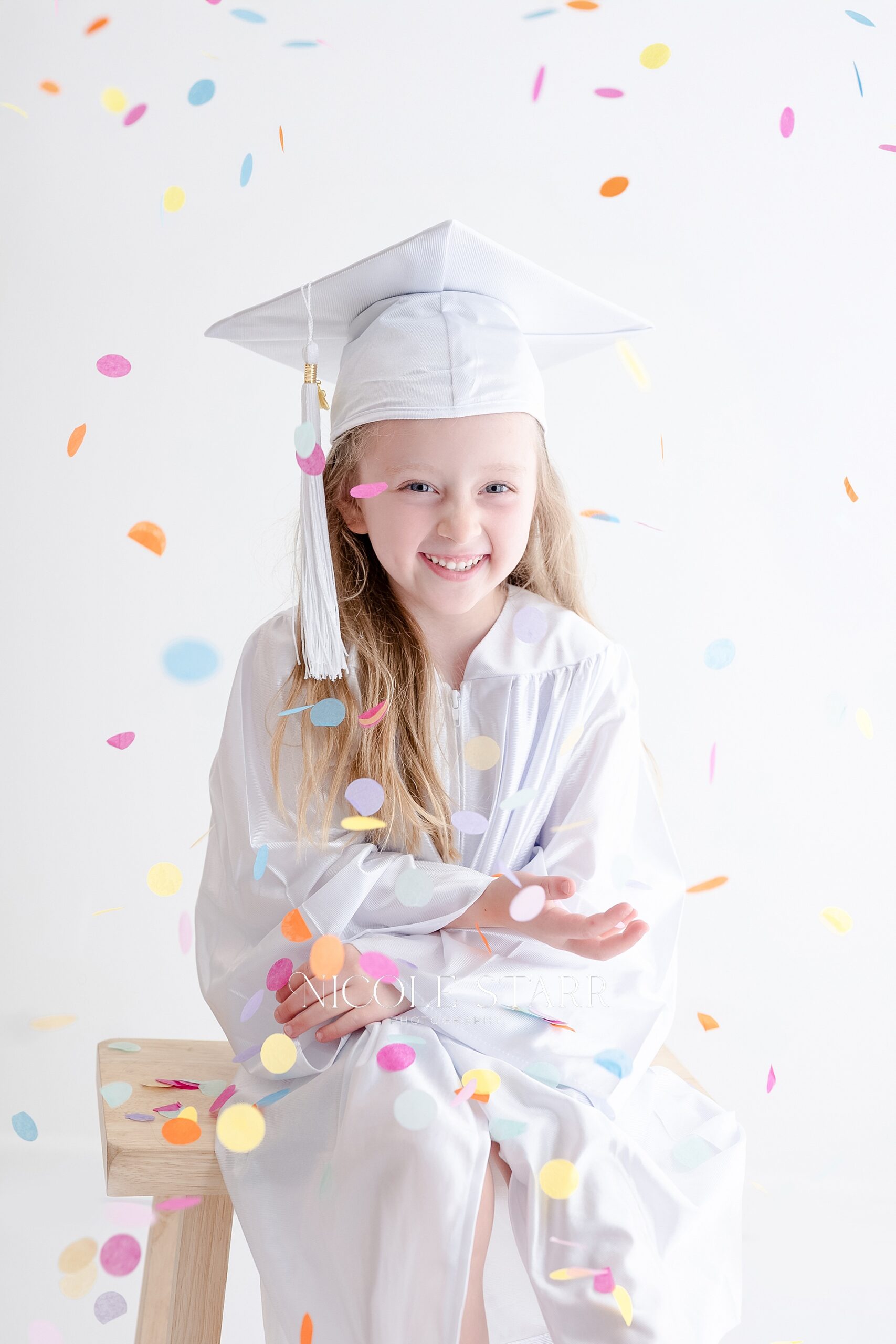 colorful confetti during tiny graduate session