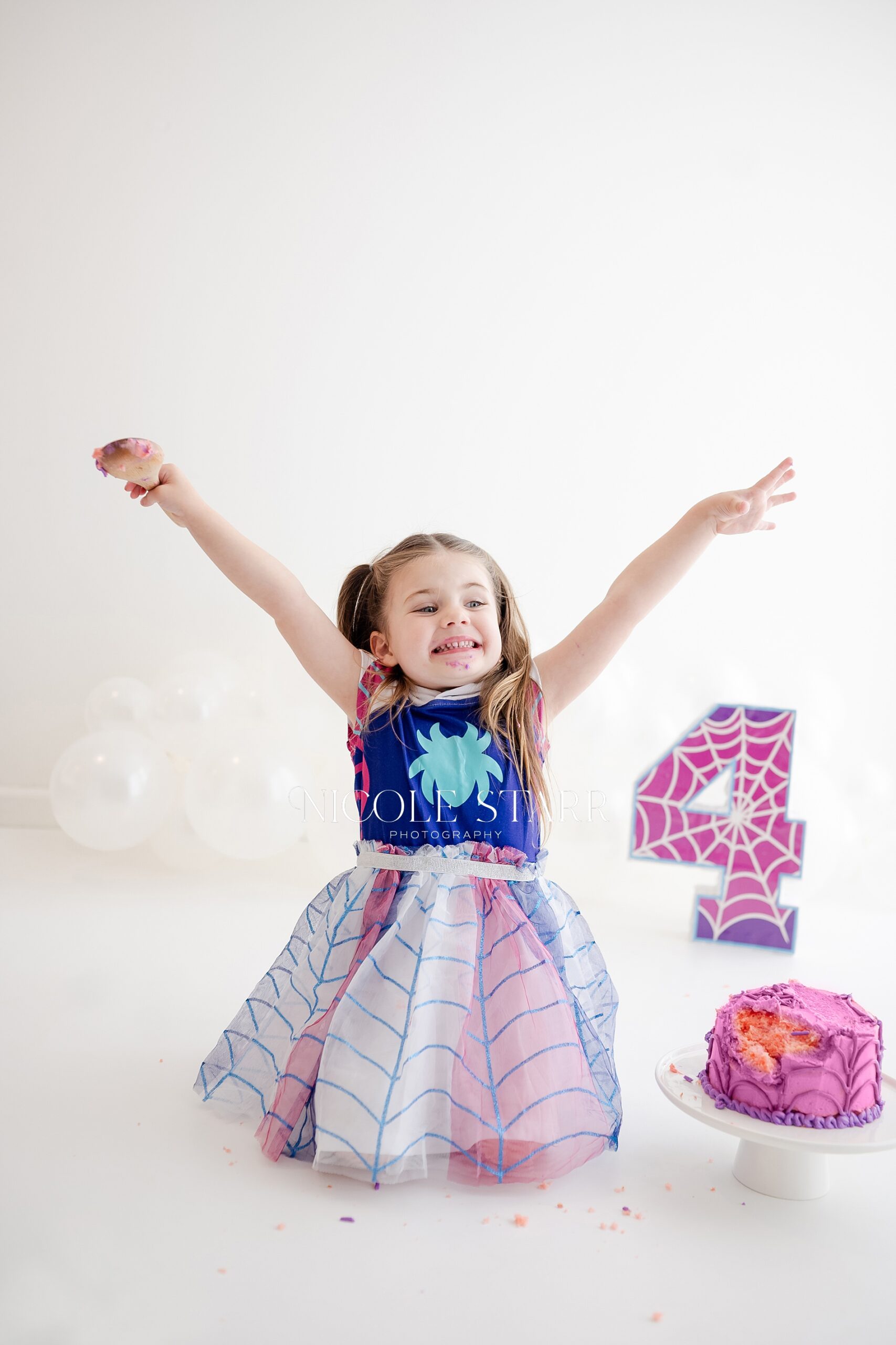 A Ghost Spider Cake Smash for fourth birthday milestone session