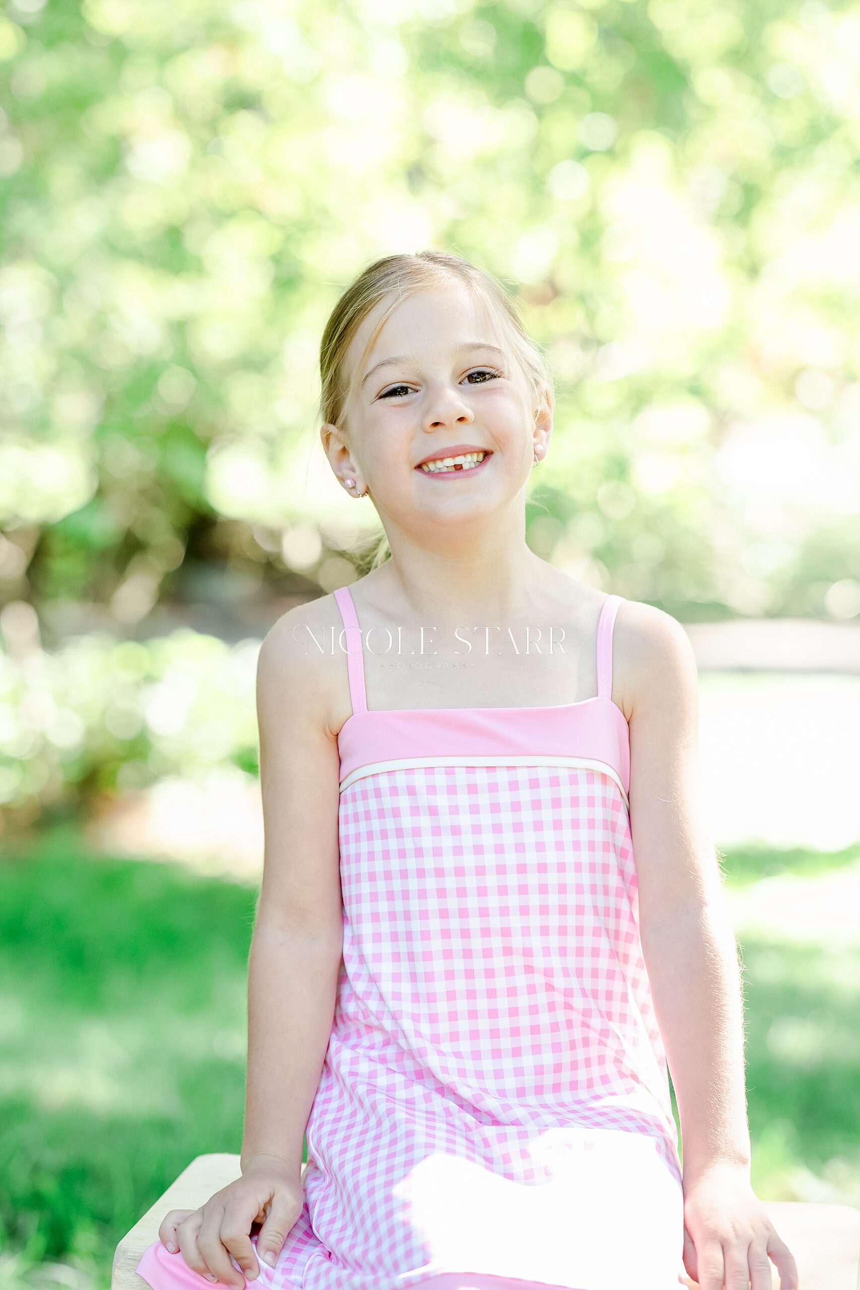 little girl in pink dress during timeless children's portraits