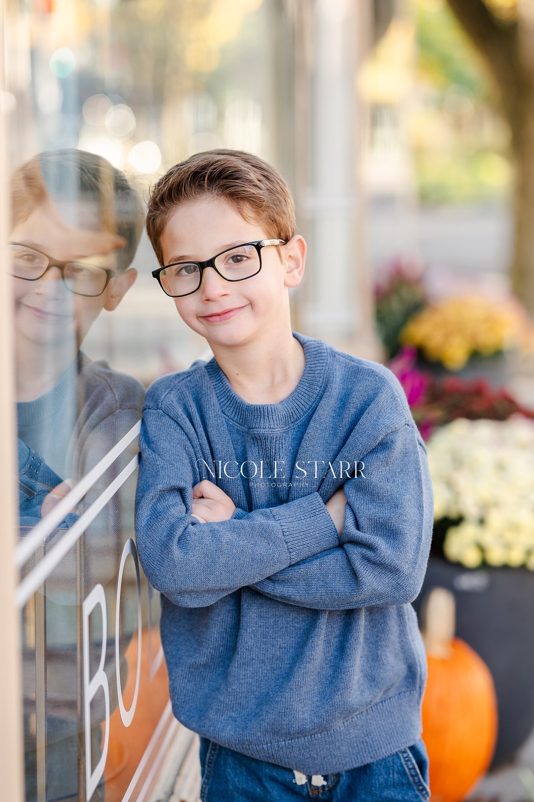 boy with glasses and a blue shirt during children's portraits