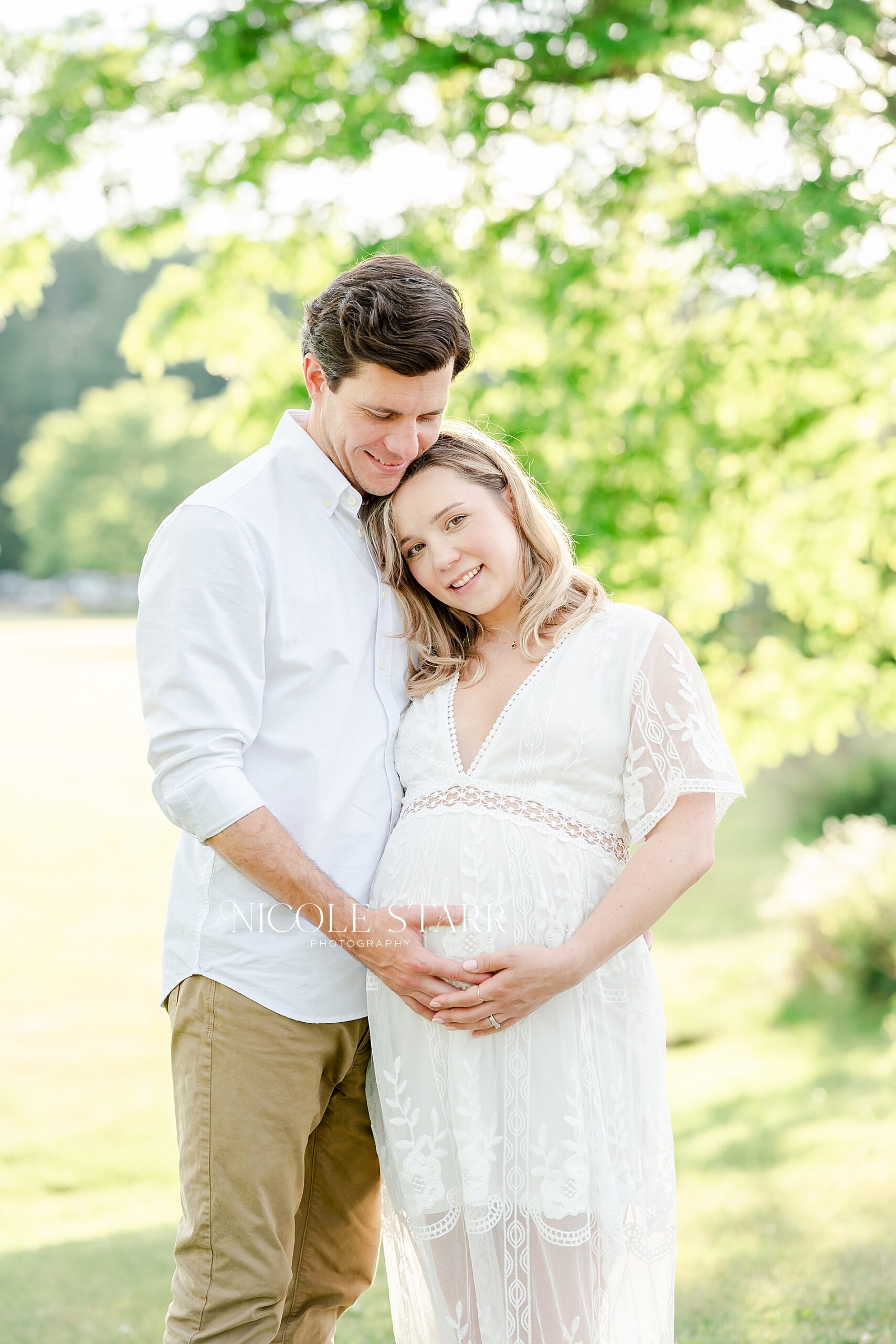 expecting parents during Golden Maternity Portraits in Saratoga Springs
