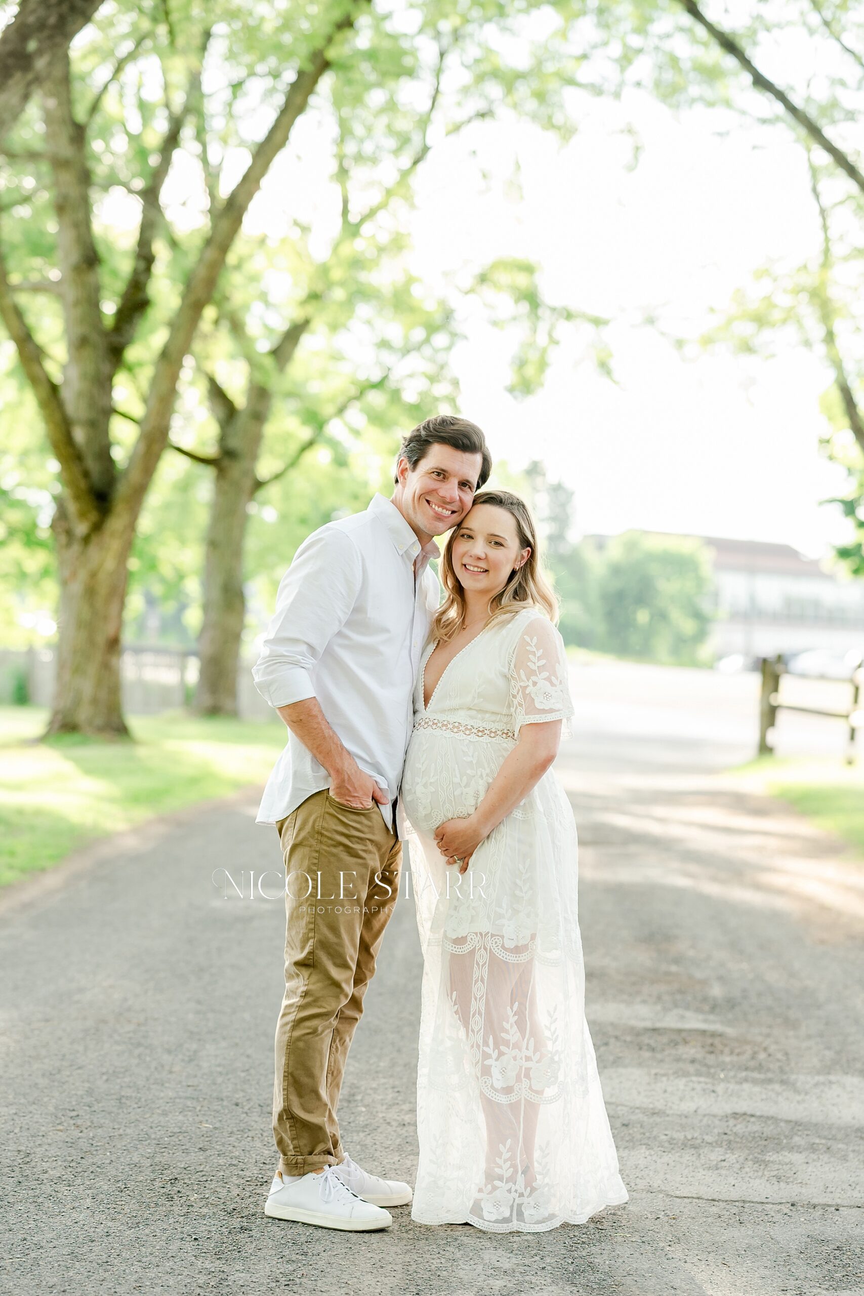 Golden Maternity Portraits in Saratoga Springs with husband and wife
