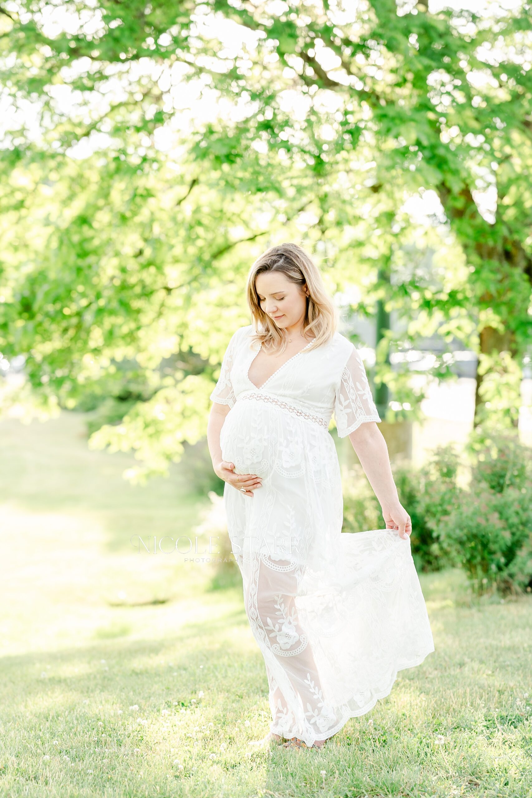 expectant mom in white lace dress