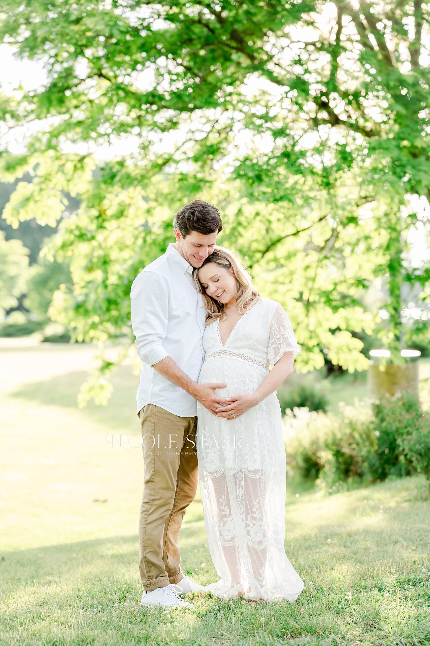 Golden Maternity Portraits in Saratoga Springs with husband and wife