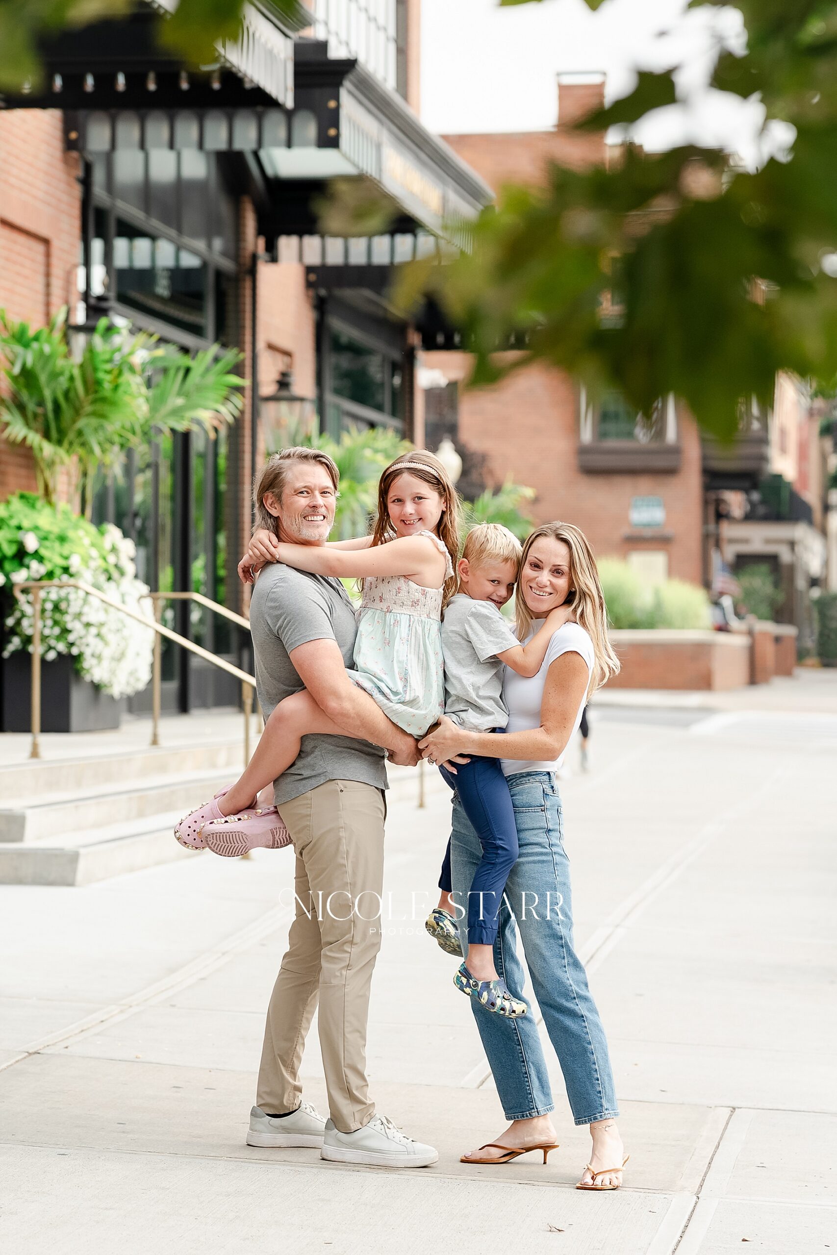 family of four during Playful Family Portraits in Downtown Saratoga Springs