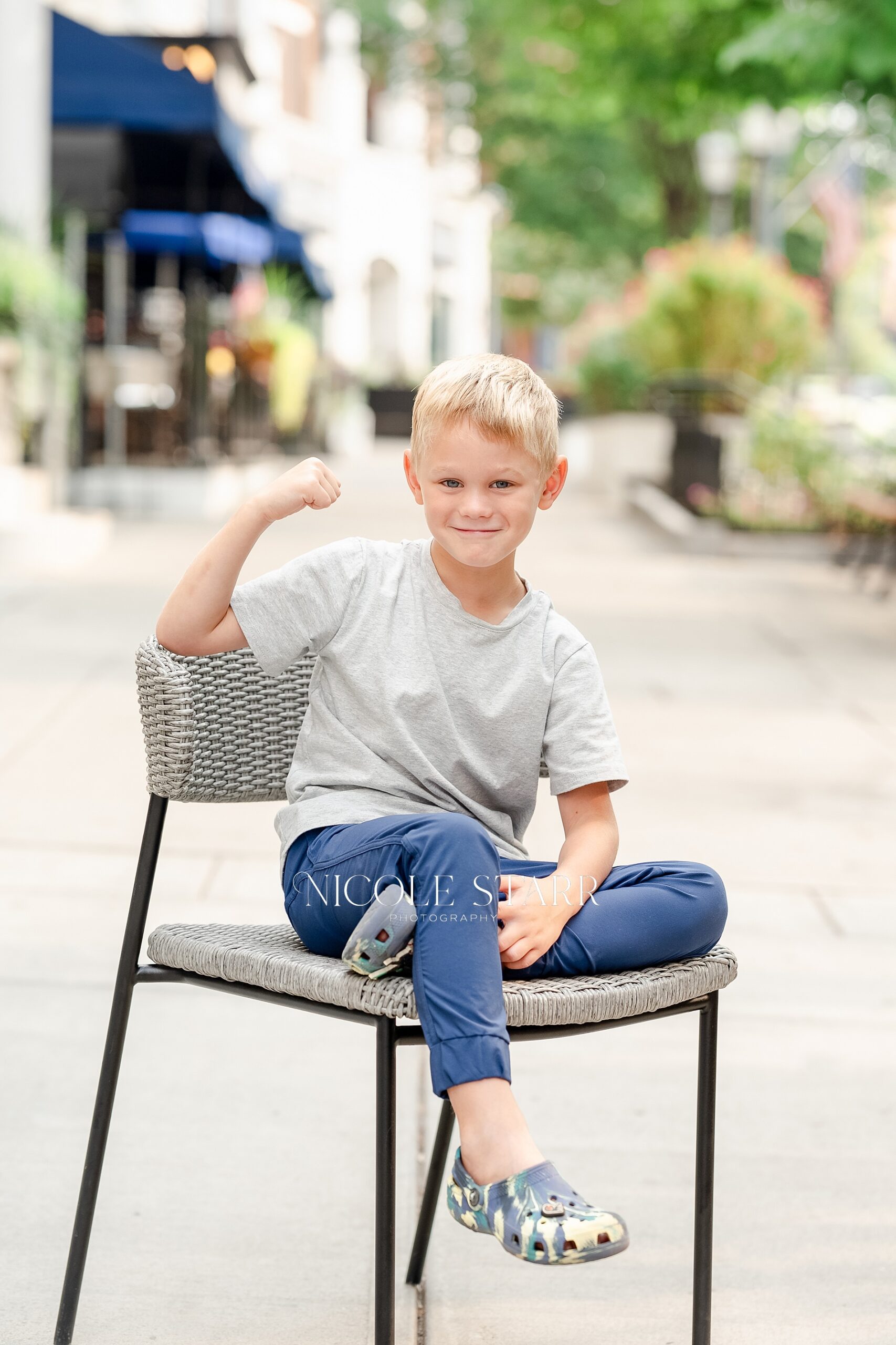 boy sits in chair